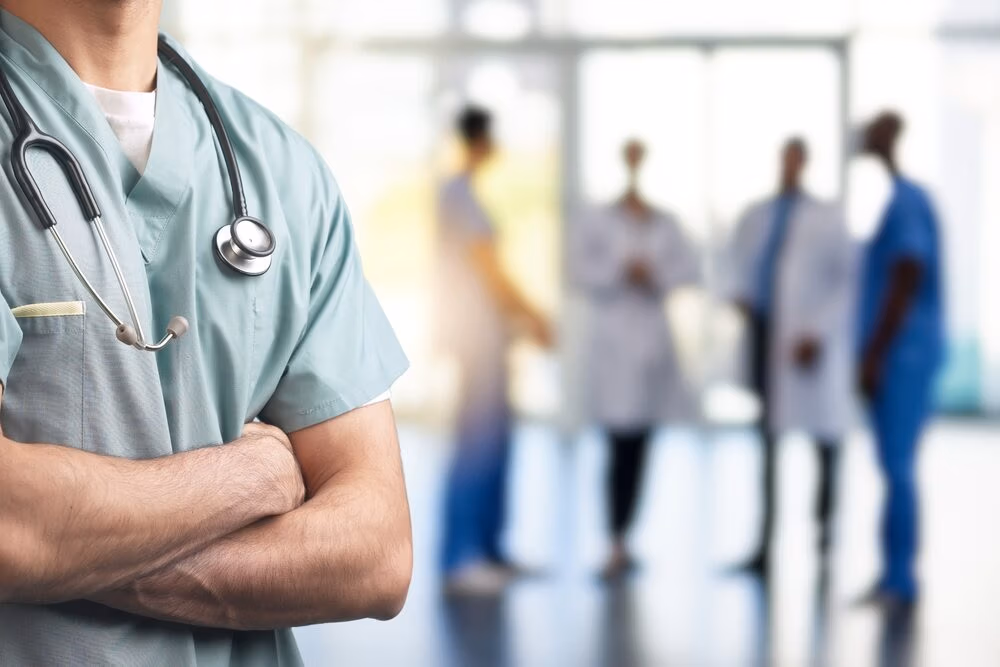 A,Close-up,Of,A,Healthcare,Professional,In,Scrubs,With,Arms UPC