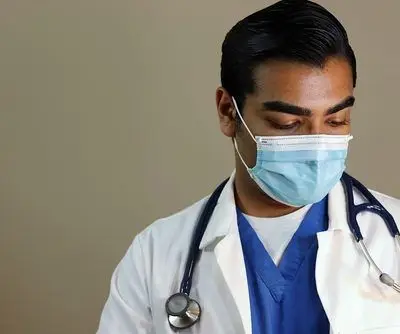 Sad,Handsome,Doctor,Looking,Down,Wearing,Face,Mask Sad,Handsome,Doctor,Looking,Down,Wearing,Face,Mask