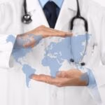 International,Medical,Coverage,Insurance,Concept,,Hands,Doctor,Covering,World,Map