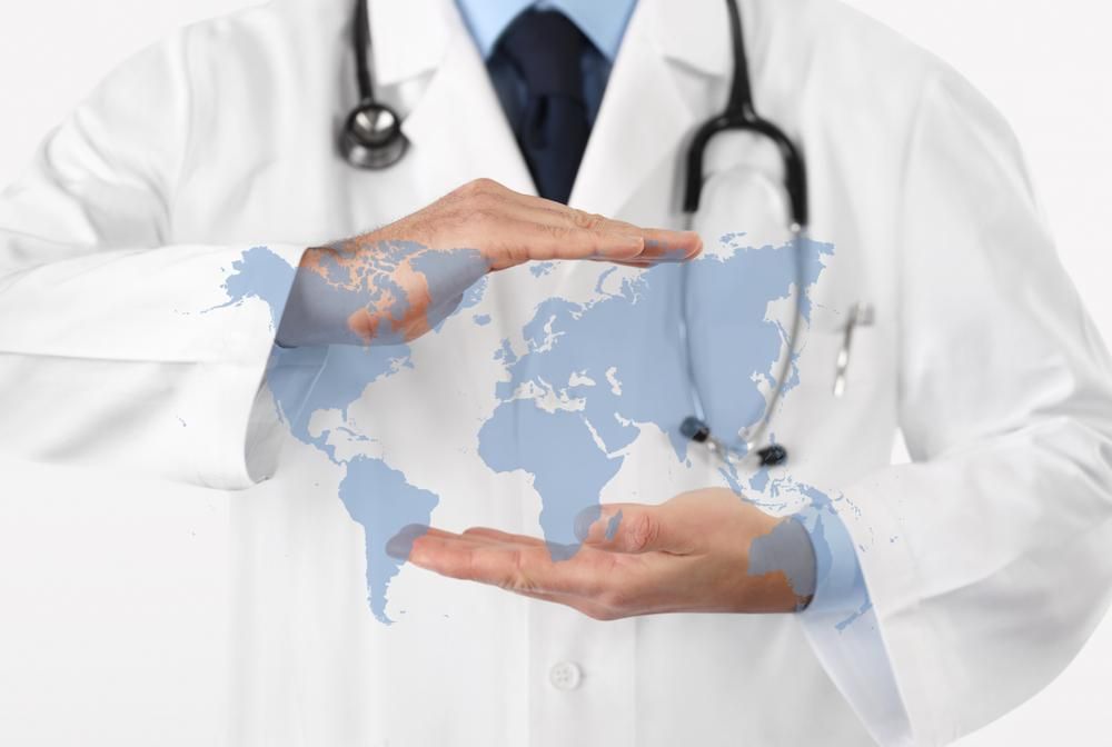 International,Medical,Coverage,Insurance,Concept,,Hands,Doctor,Covering,World,Map
