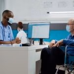 Male,Nurse,Doing,Checkup,Consultation,With,Elderly,Man,In,Wheelchair,