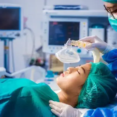 Patient,With,Mask,Ventilation,In,Operation,Room,And,Surgery,Team Patient,With,Mask,Ventilation,In,Operation,Room,And,Surgery,Team