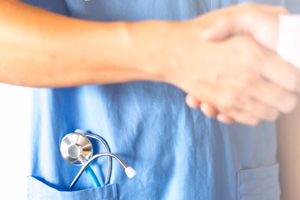 Doctor,Surgeon,Handshaking,With,Physician,Team,Or,Patient,As,Ensure