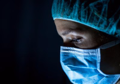 Portrait,Of,Young,Female,Surgeon,,Wearing,Mask,And,A,Surgical Portrait,Of,Young,Female,Surgeon,,Wearing,Mask,And,A,Surgical