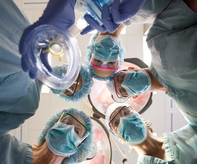Directly,Below,Portrait,Of,Surgeons,With,Oxygen,Mask,In,Operation