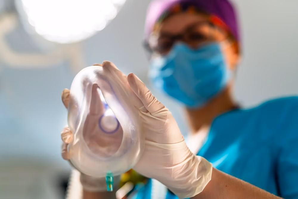 Oxygen,Mask,From,The,Eyes,Of,A,Patient.,Female,Anesthesiologist Oxygen,Mask,From,The,Eyes,Of,A,Patient.,Female,Anesthesiologist
