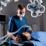 Anesthesiologist,Making,Ingalation,Anesthesia,For,Patient.,Doctor,Puts,A,Mask