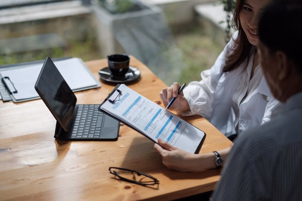 Female,Health,Insurance,Broker,Presenting,His,Insurance,Benefits,To,Businessman Female,Health,Insurance,Broker,Presenting,His,Insurance,Benefits,To,Businessman
