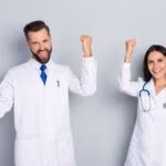 Portrait,Of,Two,Attractive,Cheerful,Lucky,Medics,Rejoicing,Having,Fun