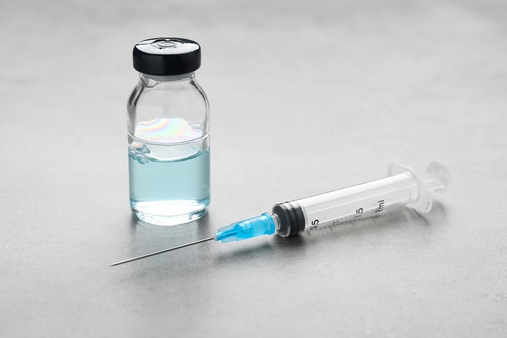 Syringe,And,Vial,On,Grey,Table.,Medical,Anesthesia