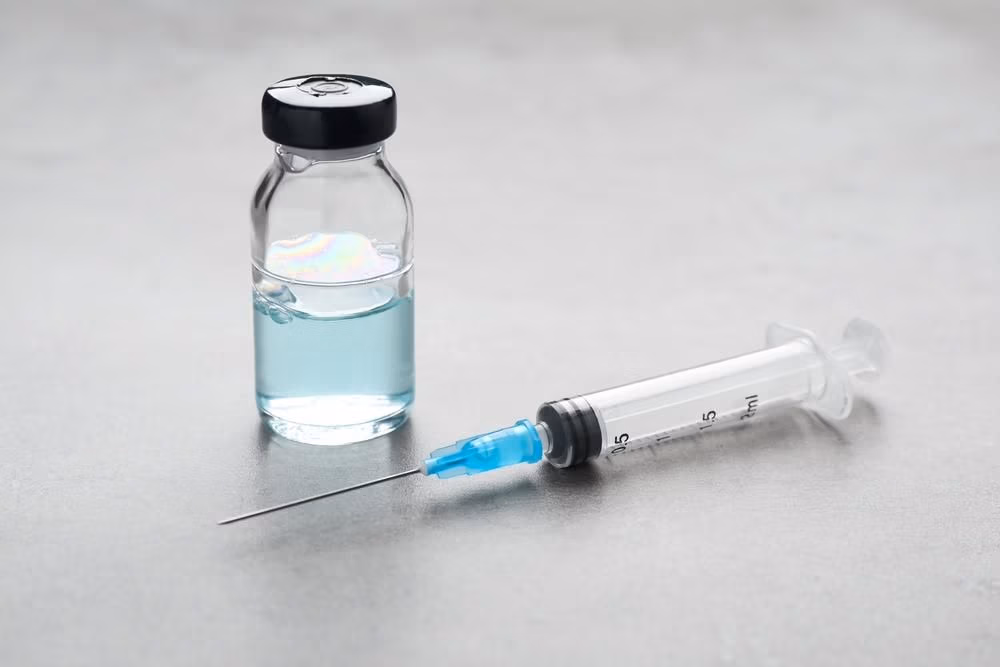 Syringe,And,Vial,On,Grey,Table.,Medical,Anesthesia Syringe,And,Vial,On,Grey,Table.,Medical,Anesthesia
