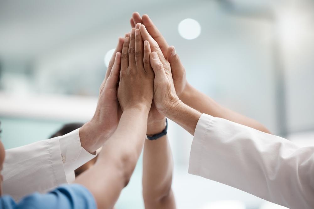 High,Five,,Teamwork,And,Doctors,Hands,In,Collaboration,For,Mission,