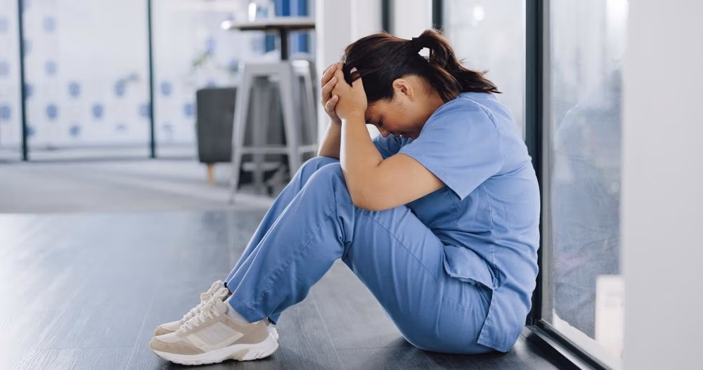 Healthcare,,Stress,And,Sad,Nurse,On,Floor,With,Burnout,,Anxiety Healthcare,,Stress,And,Sad,Nurse,On,Floor,With,Burnout,,Anxiety