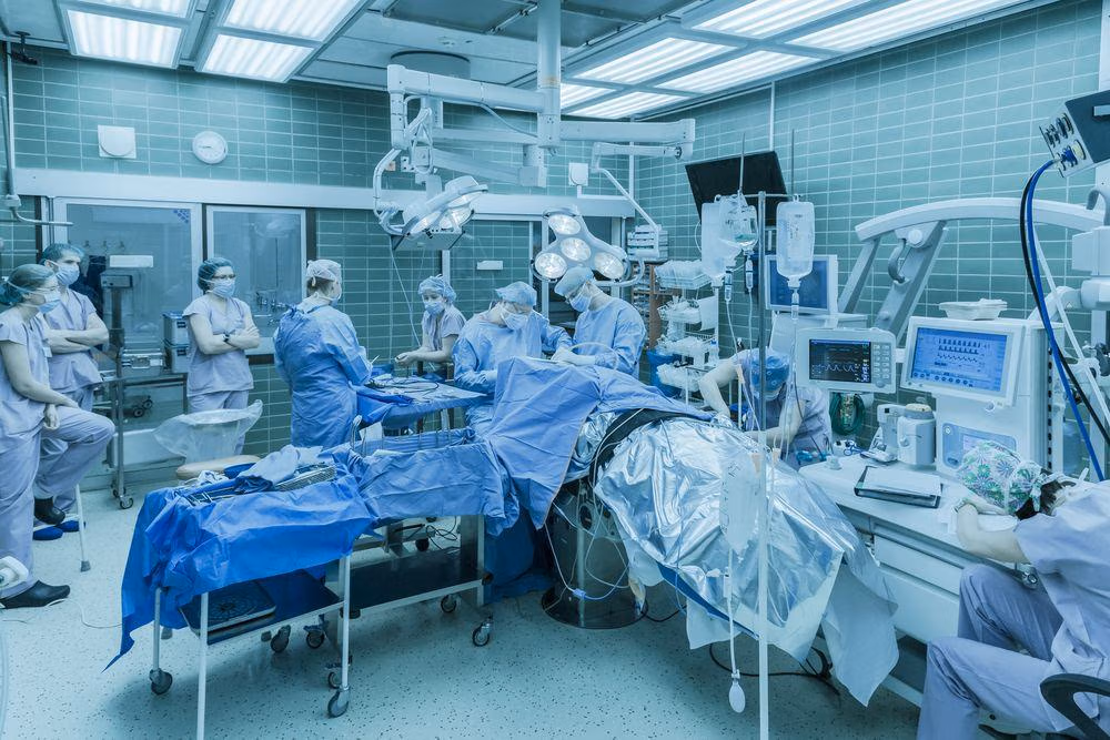 Neurosurgeons,Operate,On,A,Tumor,On,The,Brain,Of,A Neurosurgeons,Operate,On,A,Tumor,On,The,Brain,Of,A