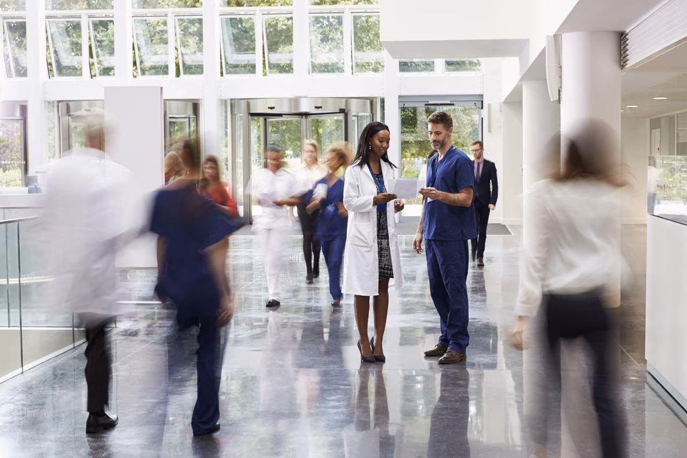 Staff,In,Busy,Lobby,Area,Of,Modern,Hospital Staff,In,Busy,Lobby,Area,Of,Modern,Hospital