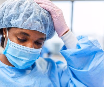 Exhausted,Nurse,On,Duty,In,The,Emergency,Room,Of,A Exhausted,Nurse,On,Duty,In,The,Emergency,Room,Of,A