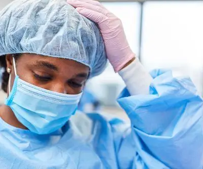 Exhausted,Nurse,On,Duty,In,The,Emergency,Room,Of,A Exhausted,Nurse,On,Duty,In,The,Emergency,Room,Of,A