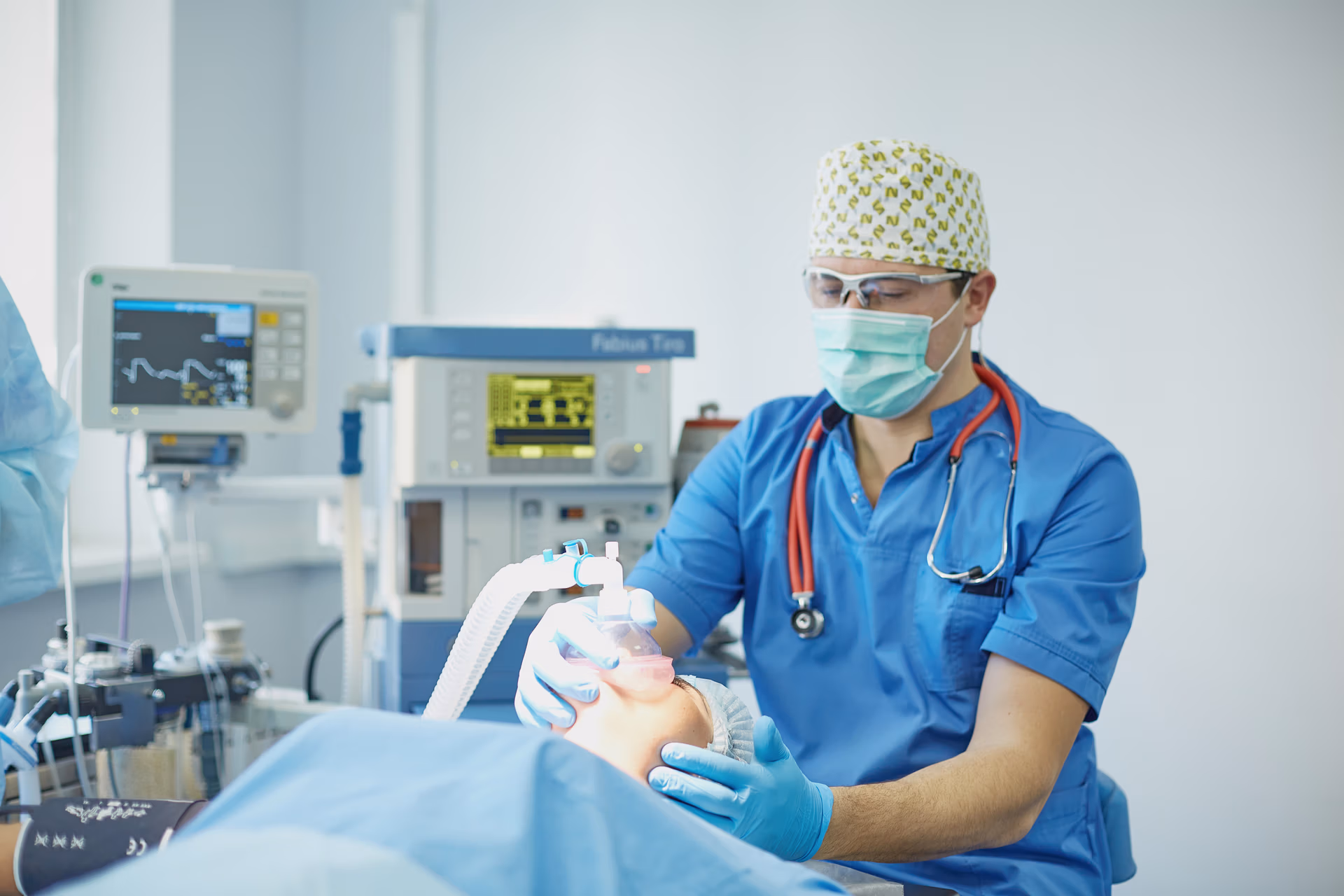 Several,Doctors,Surrounding,Patient,On,Operation,Table,During,Their,Work. Several,Doctors,Surrounding,Patient,On,Operation,Table,During,Their,Work.